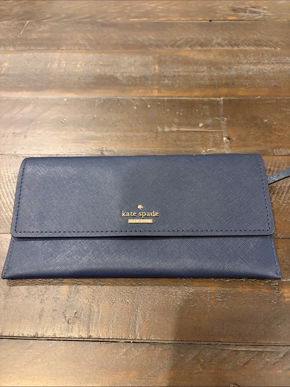 kate spade navy saffiano continental wallet with gold logo
